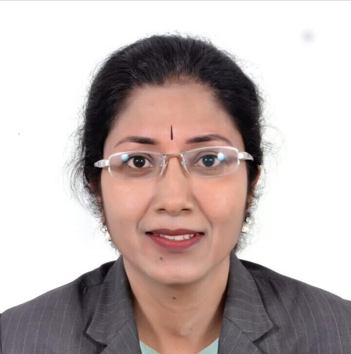 D. Shobha, a professional LIC agent in Bangalore, helping a client choose an insurance policy.